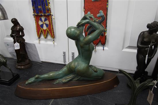 A French Art Deco painted terracotta model of a female nude dancer, 28in.